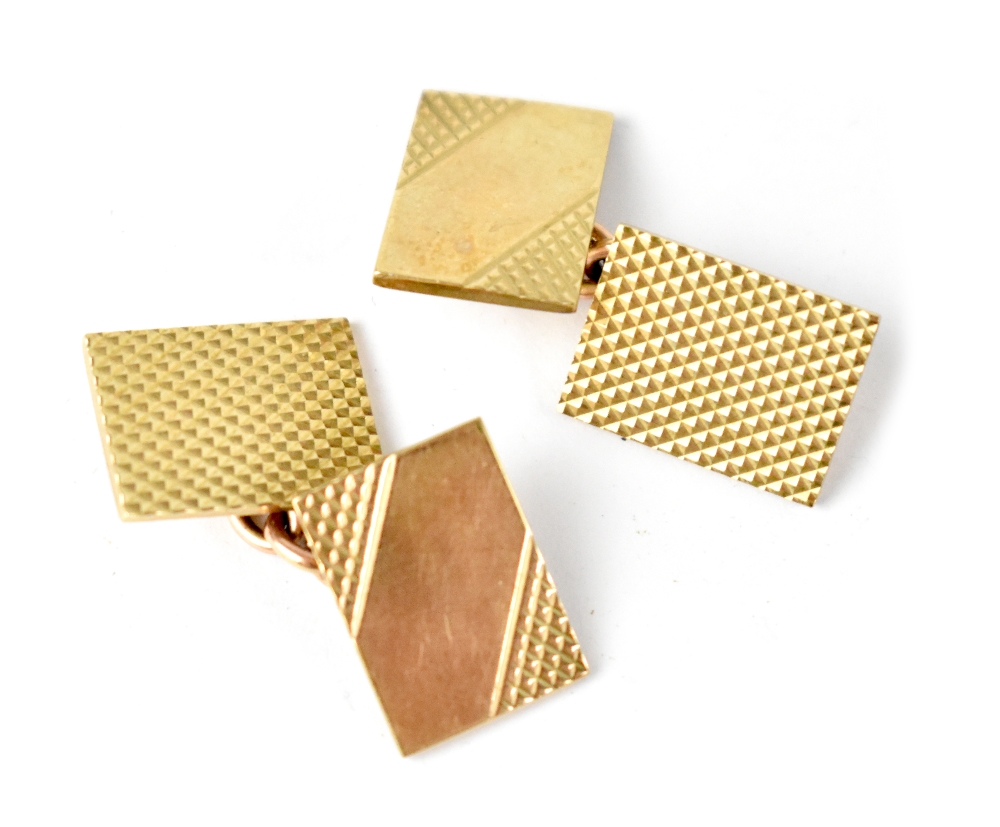 A pair of hallmarked 9ct gold cufflinks of rectangle shape and engine turned decoration united with