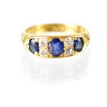 An 18ct yellow gold diamond and sapphire ring,