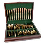 A Flexfit seventy-six piece, twelve person setting gold tone cutlery set,