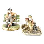 A Capodimonte figural group, an old fisherman playing with a young boy,