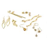 Seven pairs of gold and other metal earrings, various shapes and sizes, etc.