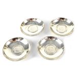 Four Middle Eastern silver coin inset pin dishes, diameter of each approx 8cm,
