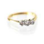 An 18ct gold three stone diamond ring,