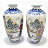 A pair of modern Chinese porcelain vases of ovoid form with flared necks, with printed and