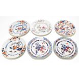 A pair of 18th century Chinese porcelain Famille Rose octagonal plates decorated with objects,