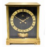 JAEGER LECOULTRE; a gilt brass cased Atmos clock, with marble effect dial and side panels, height