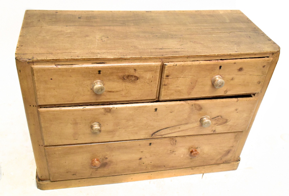 An old pine chest of two short over two long drawers, raised on plinth base, length 102, depth 41cm,