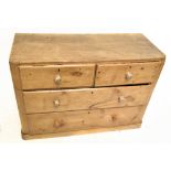 An old pine chest of two short over two long drawers, raised on plinth base, length 102, depth 41cm,
