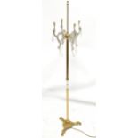 A gilt brass standard lamp with glass drops, height excluding shade 166cm.