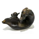 A Chinese bronzed sculpture of an elder beside teapot, impressed signature to base, height 7cm,