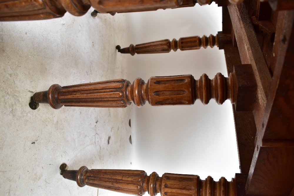 A late 19th century French oak extending dining table with rounded rectangular top on fluted legs to - Image 6 of 8