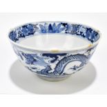 A 19th century Chinese blue and white porcelain footed bowl, decorated with four claw dragons and
