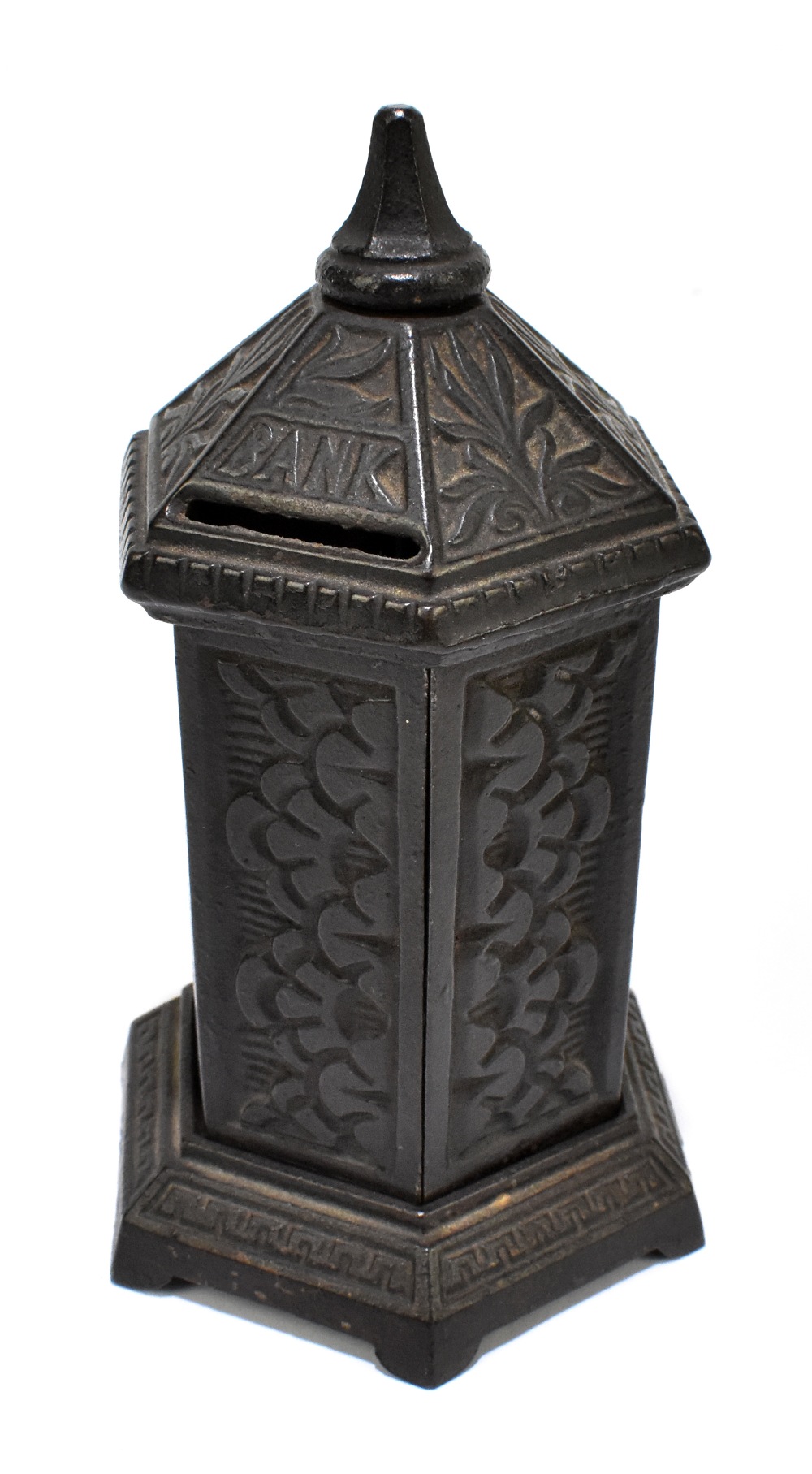 A Victorian cast iron novelty money bank of hexagonal form, impressed registration number 187026