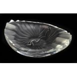 Lalique France; a frosted glass ashtray of oval form, with moulded decoration, signed Lalique France
