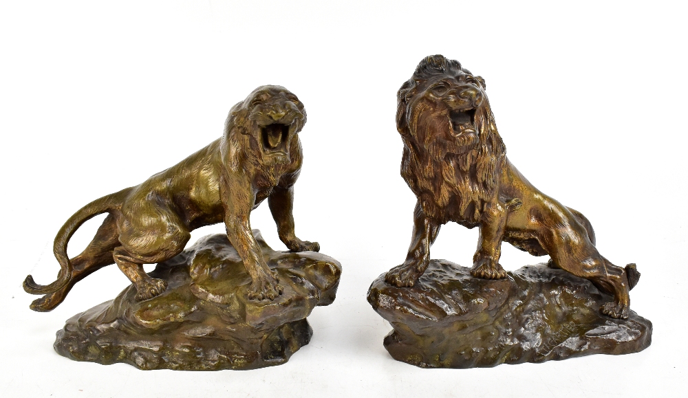 THOMAS FRANÇOIS CARTIER (1879-1943); a pair of late 19th/early 20th century bronze figures, lion and