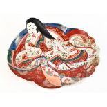 A Japanese Meiji period Imari dish modelled as a young woman, apocryphal six character mark to the