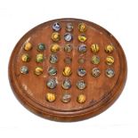 A 19th century solitaire board housing thirty one 19th century marbles with internal swirls, each