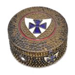 A Continental silver and enamel pillbox of circular form, the cover with shield shaped cross,