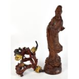 A modern hardwood Chinese carved figure of Guanyin, height 45cm and an unusual dragon inspired