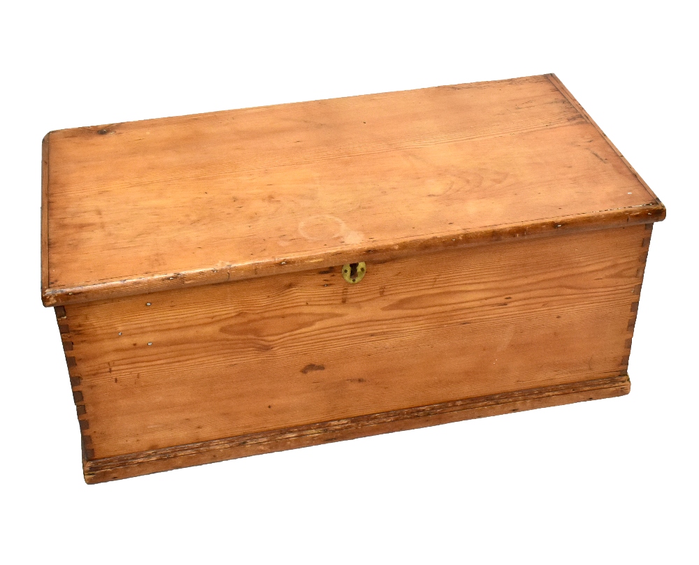 A late Victorian pine blanket box with hinged lid and twin side carrying handles, width 100cm.