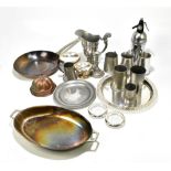 A group of metalware including 20th century pewter, a shallow pan, a circular plated tray, etc.