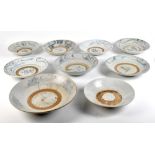 Eight Chinese Song dynasty provincial earthenware bowls with stylised underglaze blue decoration,