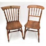 Two 19th century elm seated kitchen chairs to include a spindle back example (2).