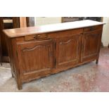 A late 19th century French oak dresser base with moulded rectangular top above two shallow frieze