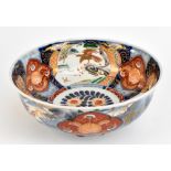 A late 19th/early 20th century Japanese Imari porcelain bowl with three internal panels featuring