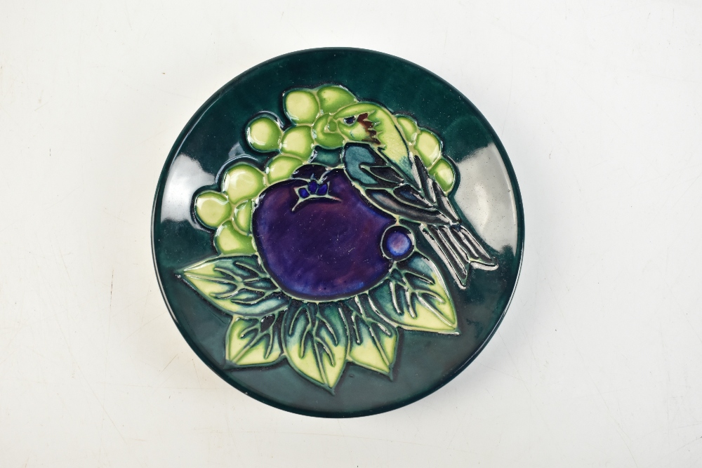 SALLY TUFFIN FOR MOORCROFT; a circular pin dish decorated with 'Finches' pattern on a green - Image 6 of 19