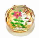 WILLIAM MANSON; a faceted glass paperweight, internally decorated with stylised butterfly and floral