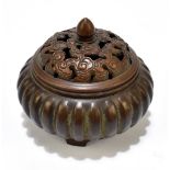 A modern Chinese bronze censer and cover, the cover with cast and pierced decoration, the base