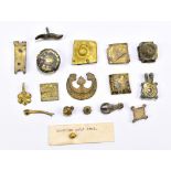 A group of gilt metal pendants, clips and similar accessories, numerous with engraved detail, also a