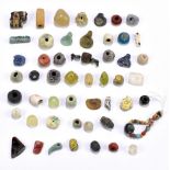 A group of ancient jewellery beads including Egyptian turquoise faience examples, of varied size,