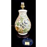 RACHEL BISHOP FOR MOORCROFT; a baluster table decorated in the 'Golden Lily' pattern, raised on