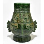 A large spinach jade archaic-style hu-form vase with inscribed oracle bone script to neck, the