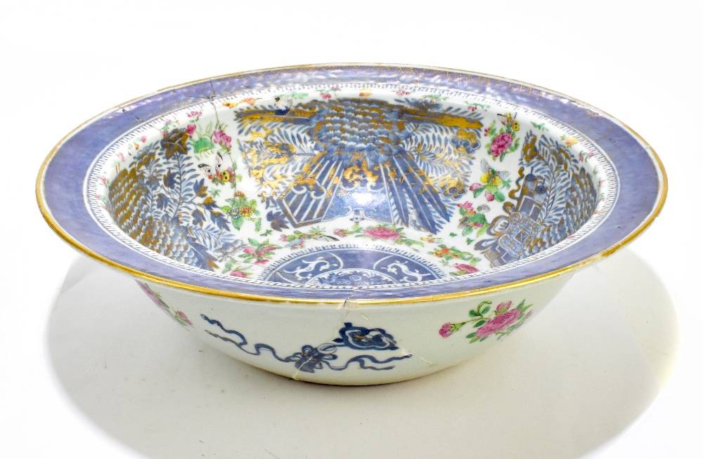 A large Chinese Canton Famille Rose bowl, painted with insects and floral sprays with gilt