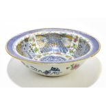 A large Chinese Canton Famille Rose bowl, painted with insects and floral sprays with gilt