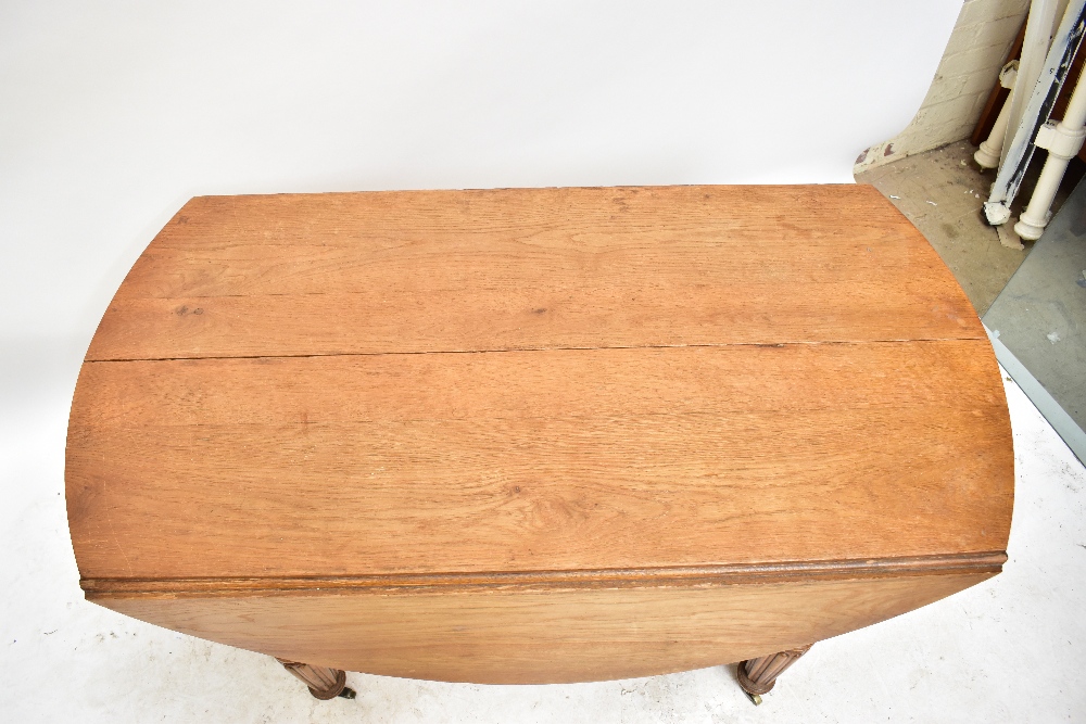 A late 19th century French oak extending dining table with rounded rectangular top on fluted legs to - Image 2 of 8