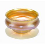LOUIS COMFORT TIFFANY; a miniature Favrile glass bowl with panelled decoration and iridescent