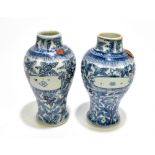 A pair of 18th century Chinese blue and white porcelain vases painted with stylised motifs, with