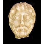 A small carved marble bust, a bearded gentleman, body lost, length 8.8cm, possibly Medieval.