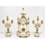 A late 19th century French gilt brass and alabaster mantel clock garniture, the circular dial set