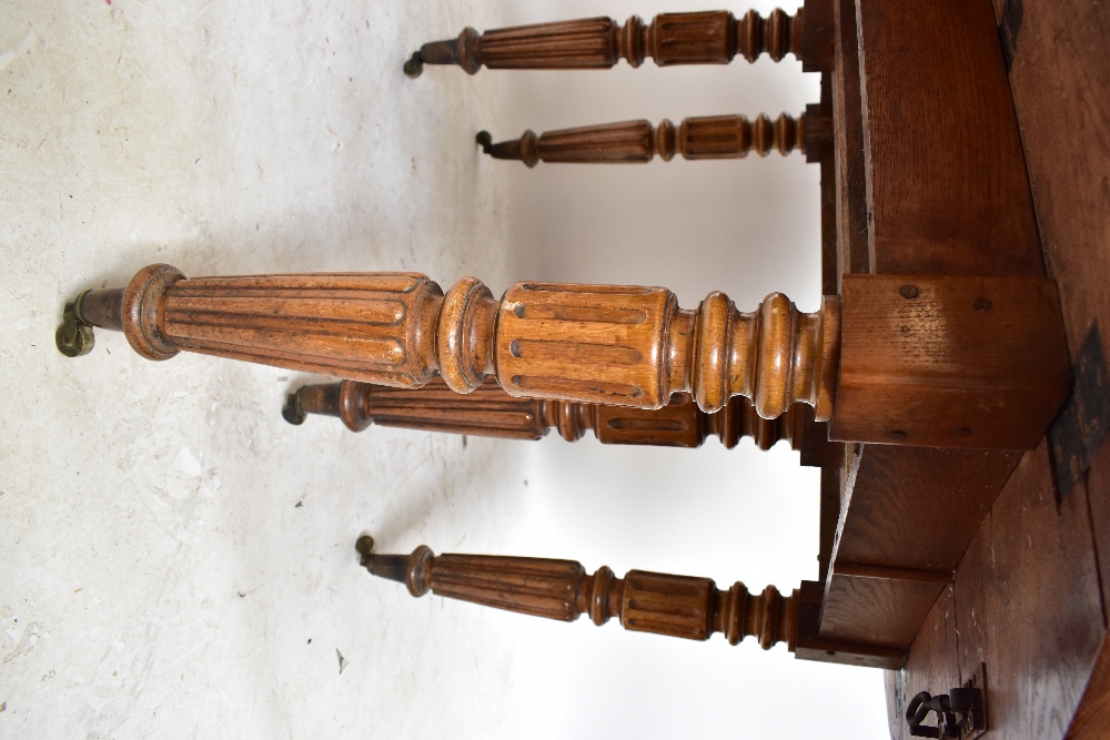 A late 19th century French oak extending dining table with rounded rectangular top on fluted legs to - Image 5 of 8