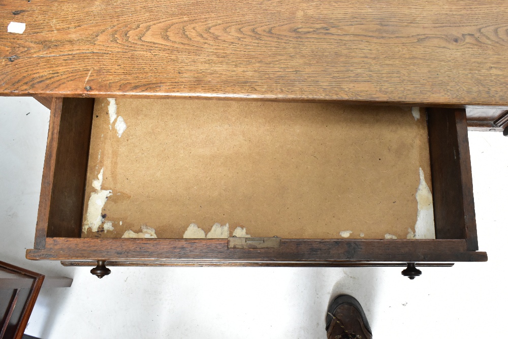 A late 19th century French oak two drawer writing table raised on chamfered square sectioned - Image 3 of 4