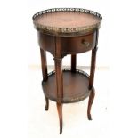 A reproduction French style side table with pierced metal gallery top and brown leather inset