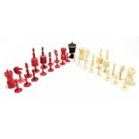 A late 19th century bone and stained bone carved chess set, height of king approx. 11.25cm, also a