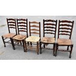 A set of four 19th century oak and elm framed ladder back rush seated dining chairs, also a