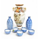 A Japanese Kutani ware twin handled vase, painted with figures beside coastal scene, with Dog of