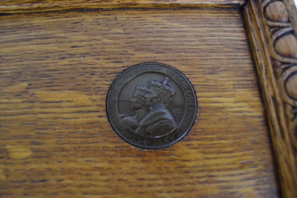 An early 20th century oak serving tray with carved border and inset King George VI Coronation - Image 2 of 3